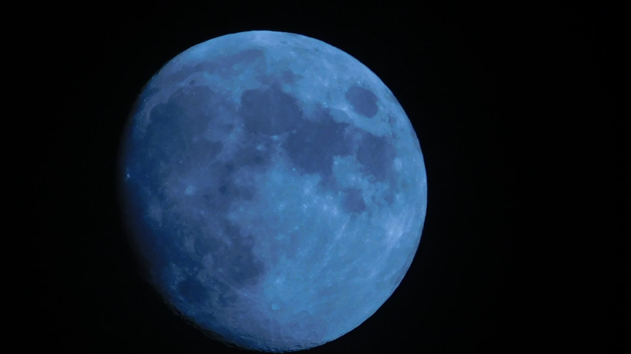 blue moon in dark room